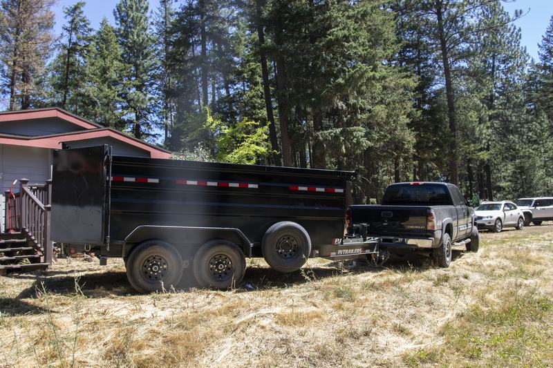 Muvit Junk Removal pickup truck and high-side dump trailer ready for a large junk haul in Spokane County